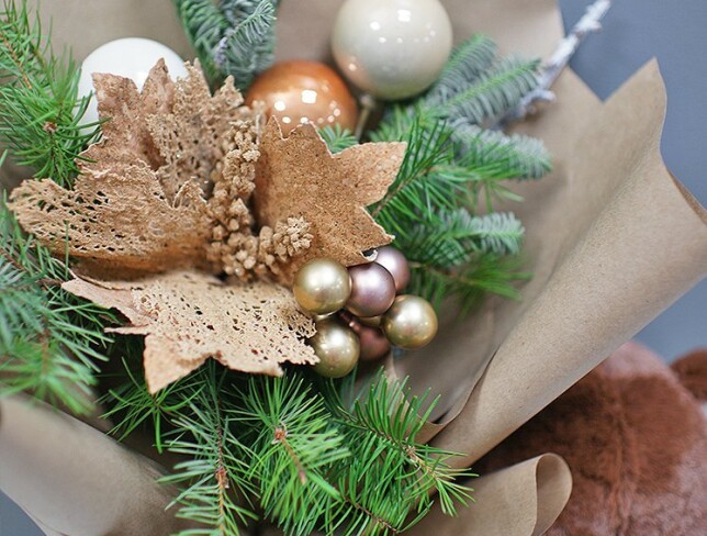 New Year bouquet of ornaments and tree, and a bear gift with candies photo